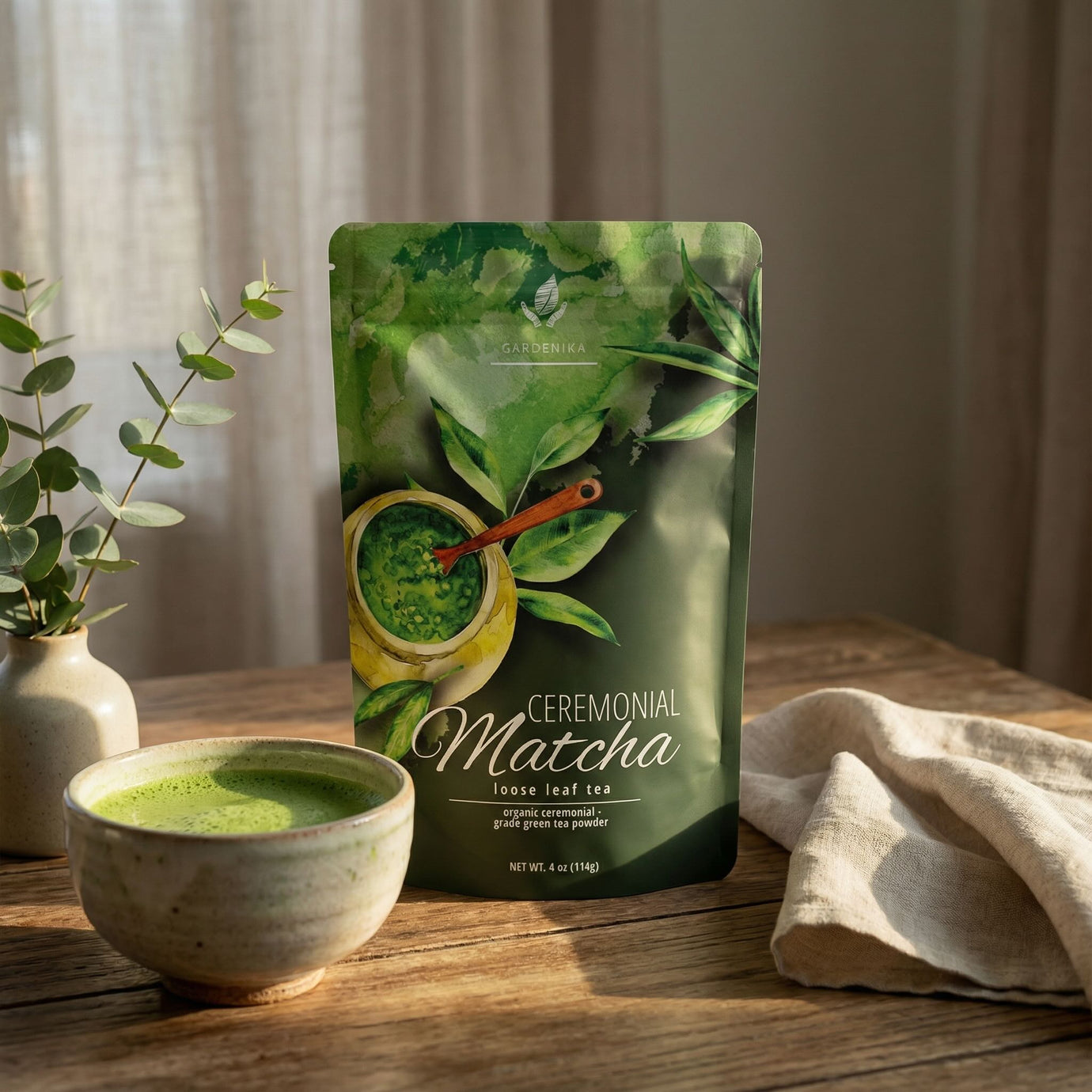 Ceremonial matcha package with a bowl of matcha on a wooden surface