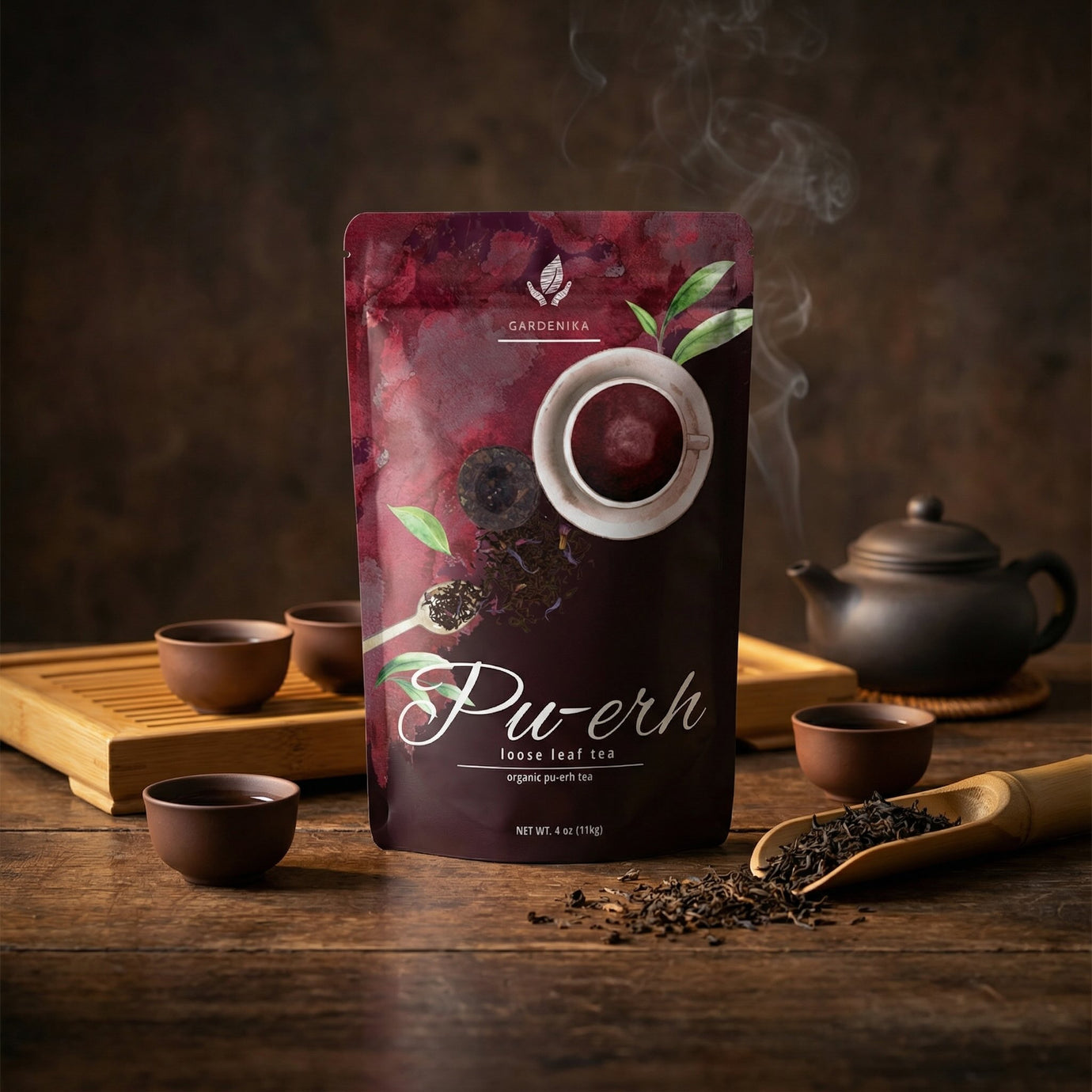 Pu-erh tea package with smoking tea leaves on a wooden table with tea-making utensils.